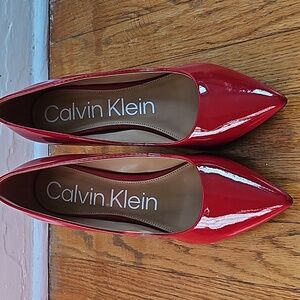 Red pointy toe pumps